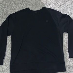 A black champion sweater.